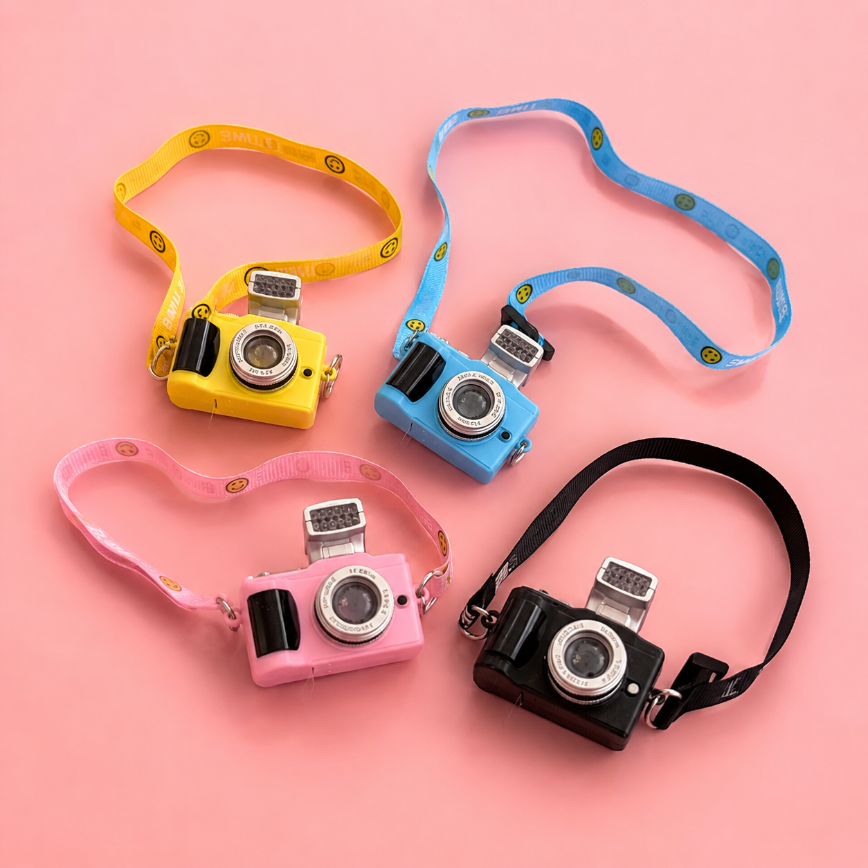 Maltese dog wearing pink camera pendant necklace
