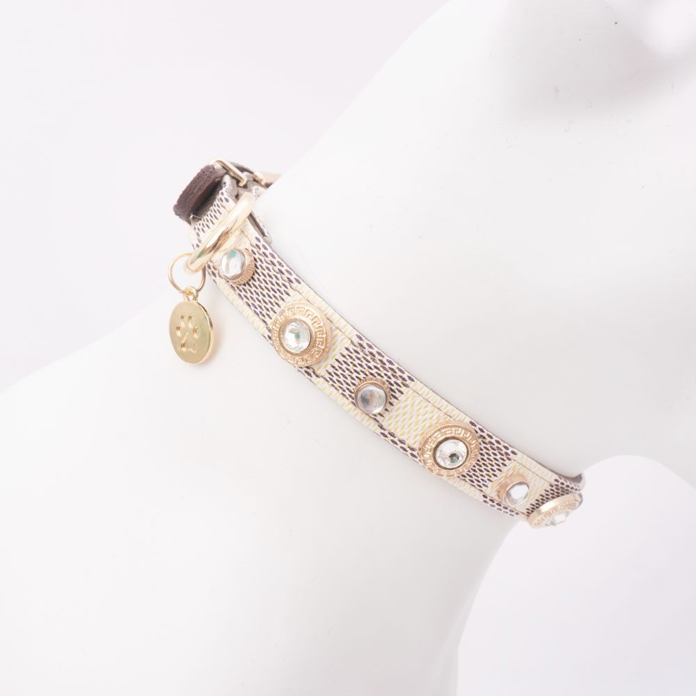 Beige jeweled leather pet collar displayed around a white neck form