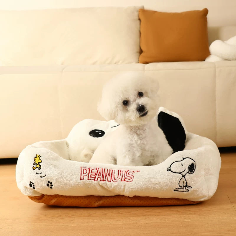 Low-angle view of white Snoopy pet sofa bed with brown base