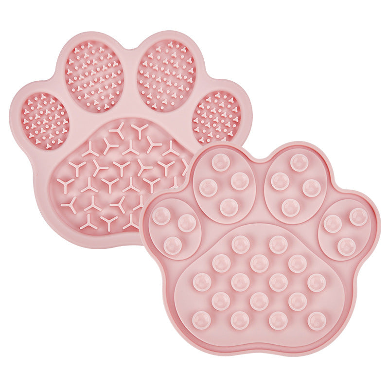 Pink paw silicone pet lick mat with raised texture and suction cup back