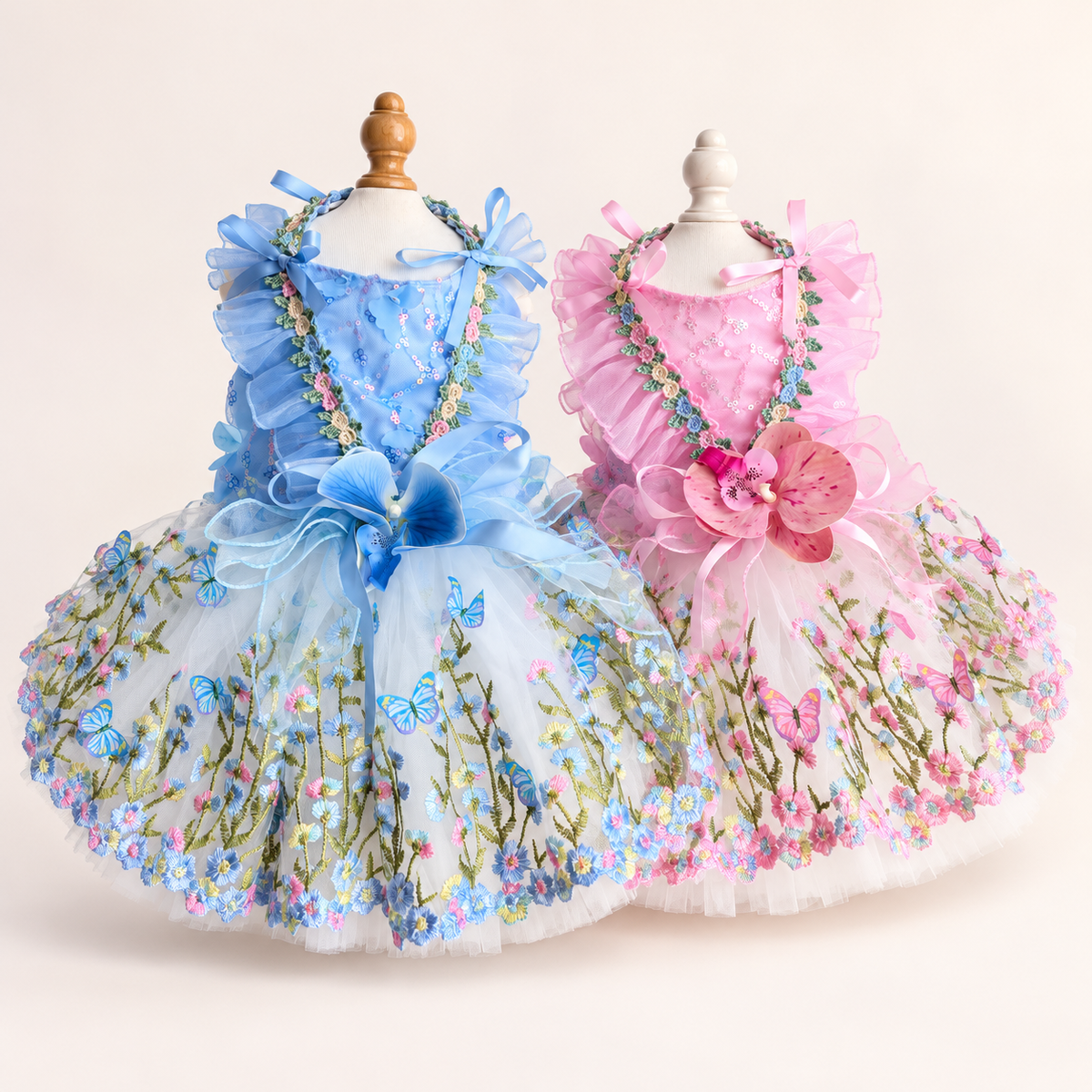 Front display of blue and pink floral butterfly tulle pet dresses