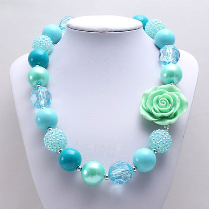 Front view of mint and teal beaded dog necklace with flower accent