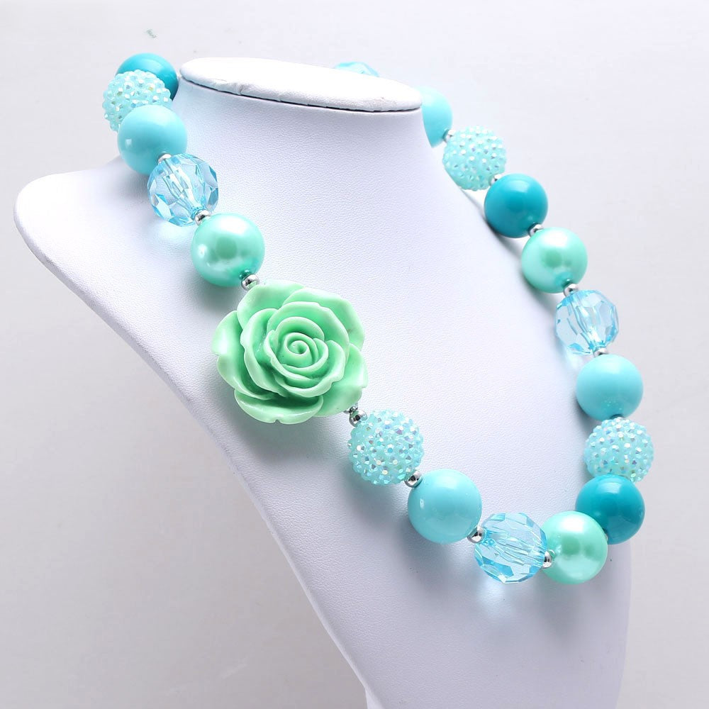 Large aqua rose beaded pet necklace displayed on white jewelry bust