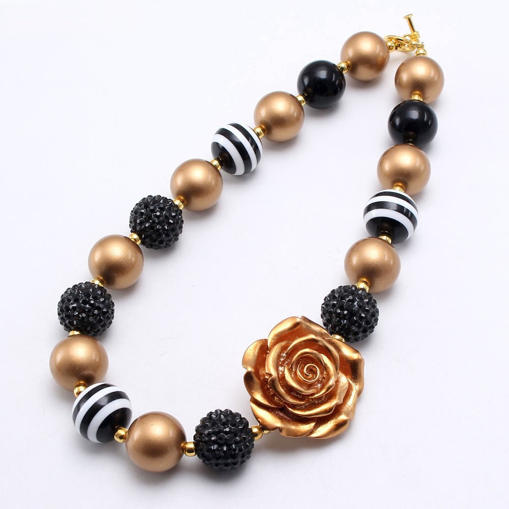 Full flat view of beaded pet necklace showing gold-tone toggle clasp and rose centerpiece