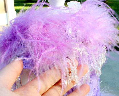 Back view of couture lavender pet bridal gown with full feather skirt