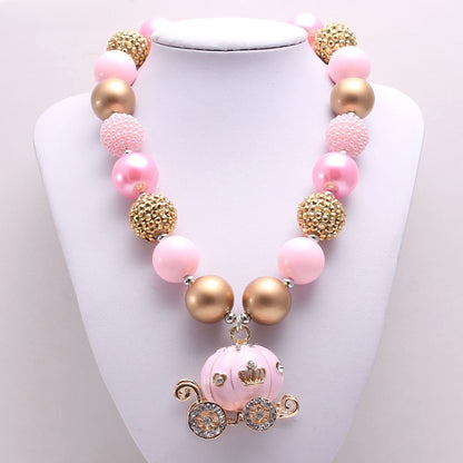 Front view of pink and gold beaded pet necklace with carriage charm