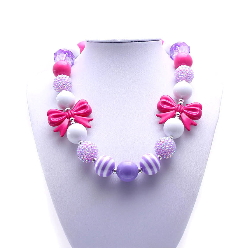 Front view of purple striped and pink bow acrylic bead pet necklace