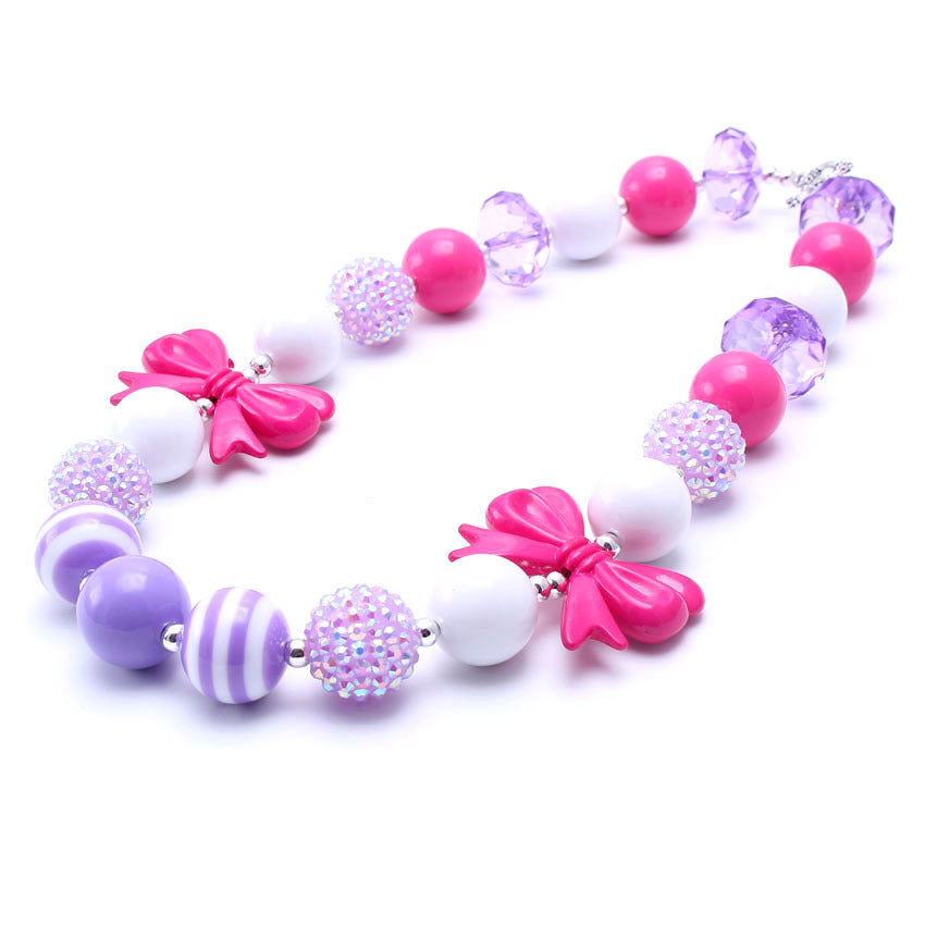 Pink purple and white acrylic beaded dog necklace with two bow accents
