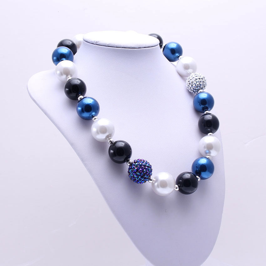 Large blue black and white beaded pet necklace displayed on white bust