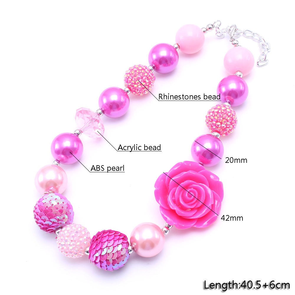Pink rose pet necklace detail showing acrylic, pearl-look and rhinestone-look beads