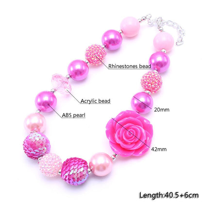 Pink rose pet necklace detail showing acrylic, pearl-look and rhinestone-look beads