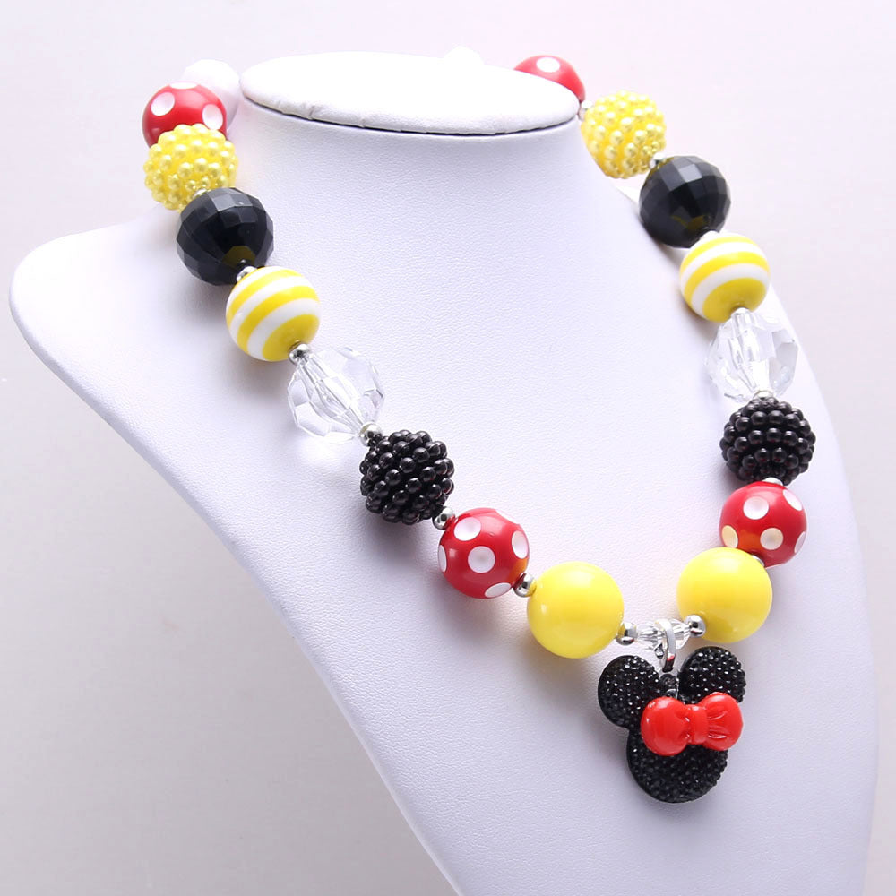 Angled Red Yellow Black acrylic bead necklace with mouse-shaped bow pendant