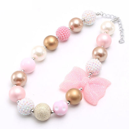 Full view of Pink Gold beaded dog necklace with extender chain and bow accent