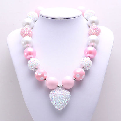 Front view of Pink White 20 mm bead dog necklace and textured heart pendant