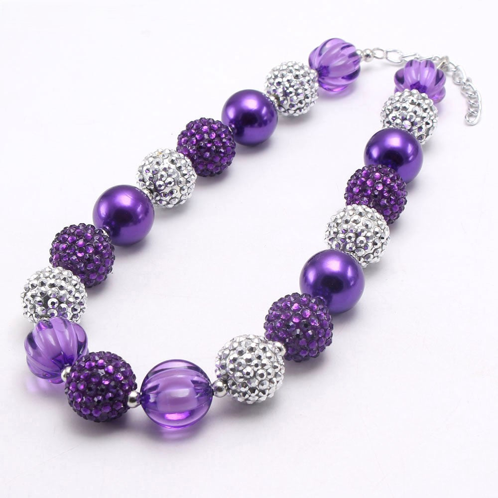 Angled view of purple and silver chunky bead dog necklace