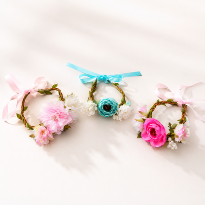Three pet floral crown headpieces in pink blue and hot pink styles