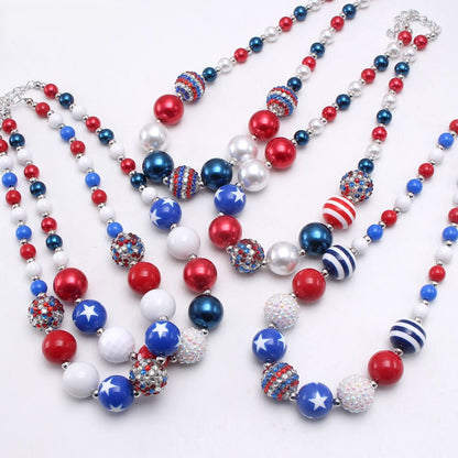 Assortment of three patriotic red white and blue beaded pet necklace designs