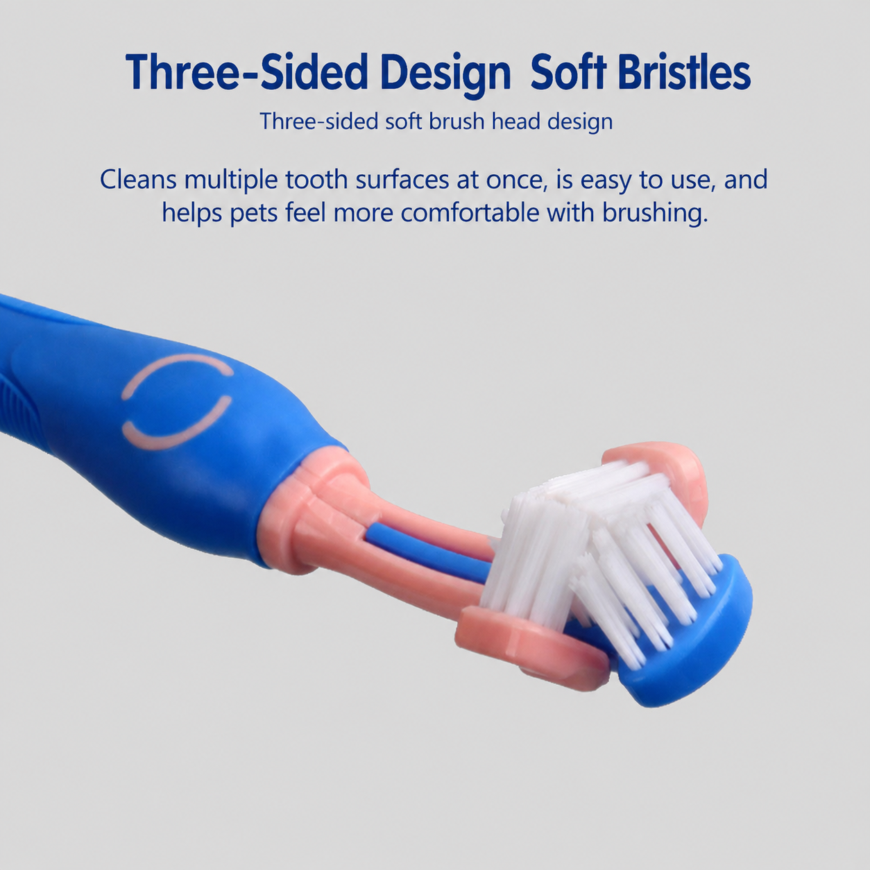 Blue and pink three-sided pet toothbrush close up with soft white brush head