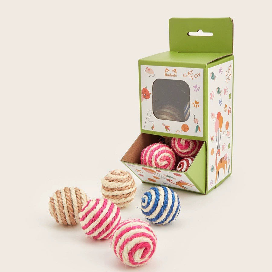 Assorted pink blue natural and ivory sisal rope cat toy balls