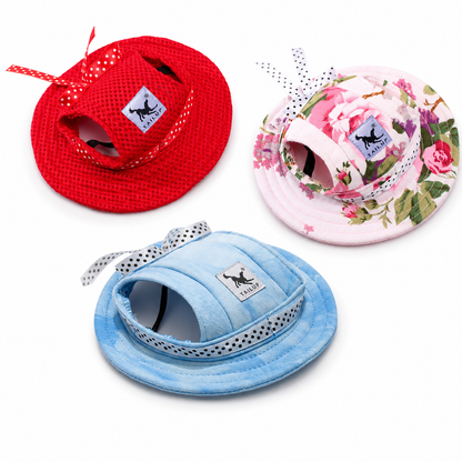 Red pink floral and blue pet sun hats with ear holes shown together