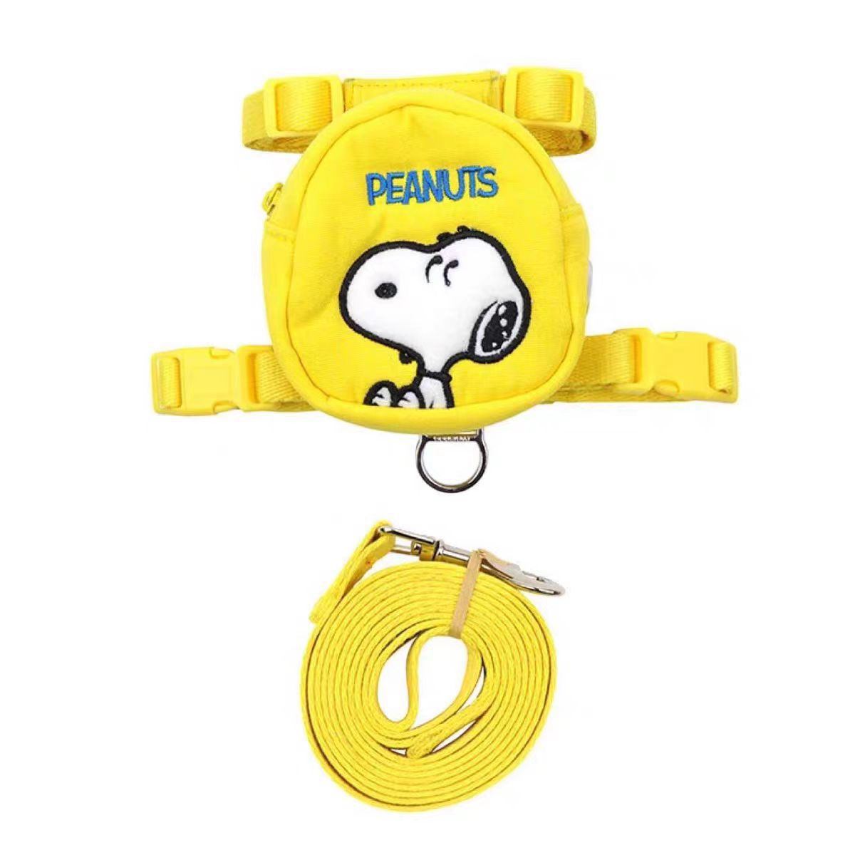 Yellow cartoon dog backpack harness set with matching leash on white background