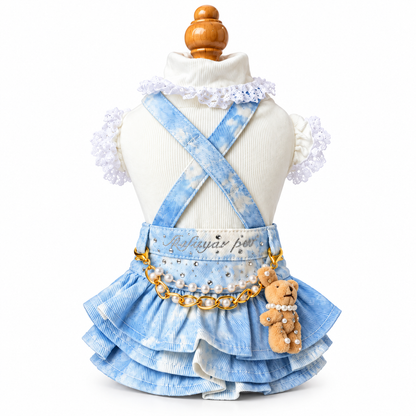Blue tie-dye denim suspender pet skirt layered over white cotton ruffle shirt