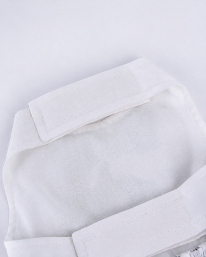 Close inside view of white Halloween pet dress bodice and hook and loop closure tabs