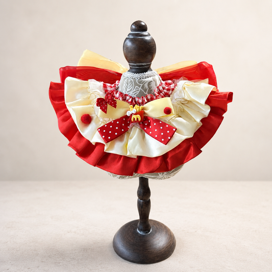 Front view of red yellow satin lace pet bib collar with ruffles polka dot bow and charm detail