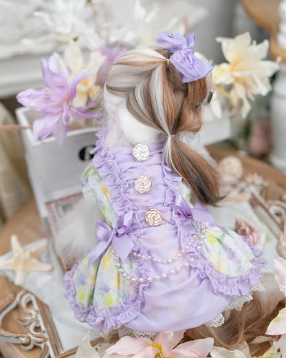 Rear view of lavender pearl dog dress with floral print, pearl chain accents, and rose button details