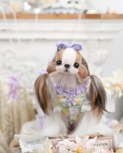 Small dog wearing lavender floral princess pearl dog dress with boutique styling