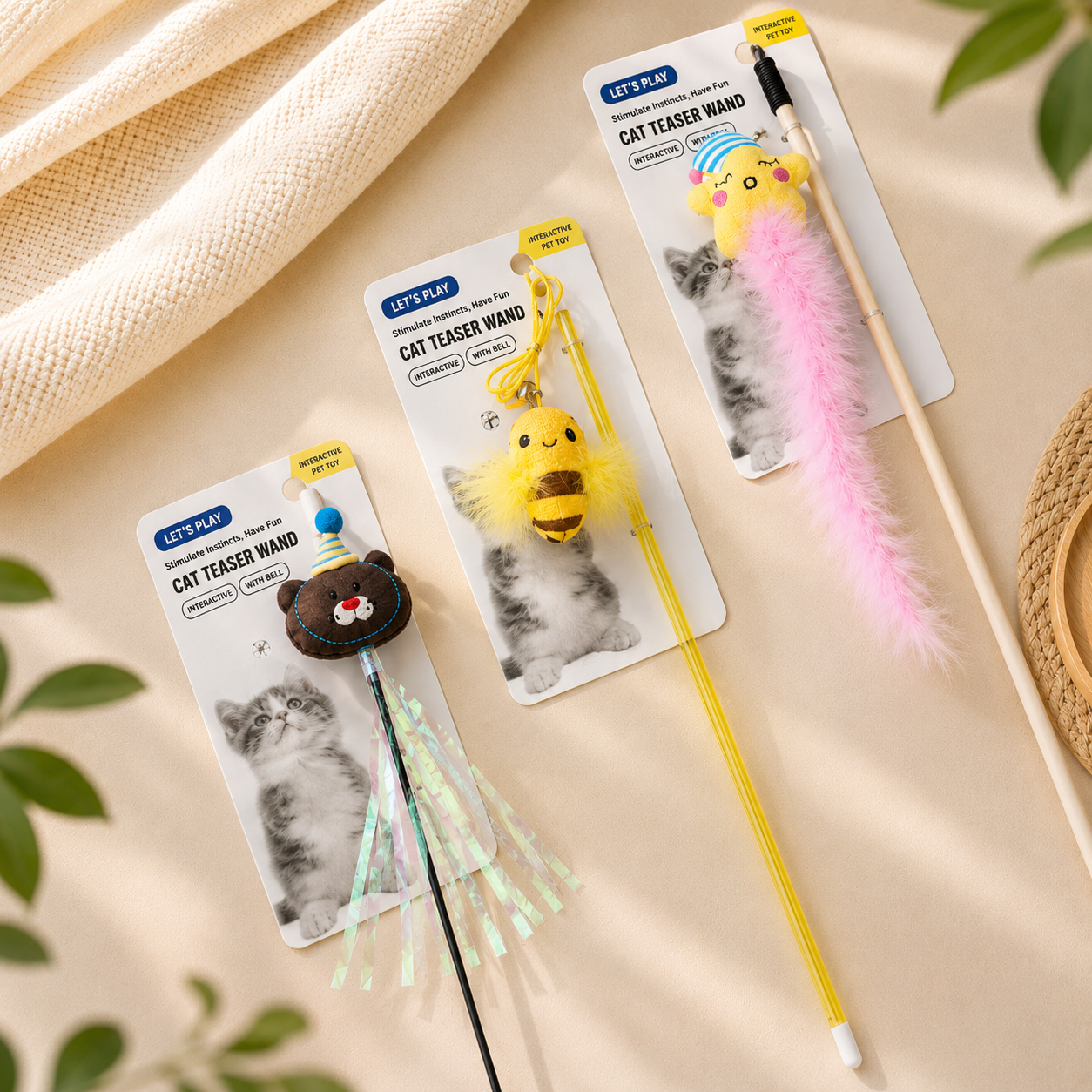 Character cat teaser wands with bell, plush toppers, streamers, feathers, and lightweight handles for interactive cat play