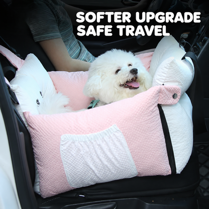 Small white dog riding in pink cushioned pet car booster seat