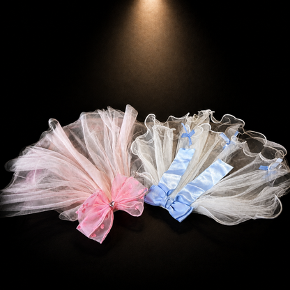 Pink and blue tulle bow pet veil hair clips displayed together on black background