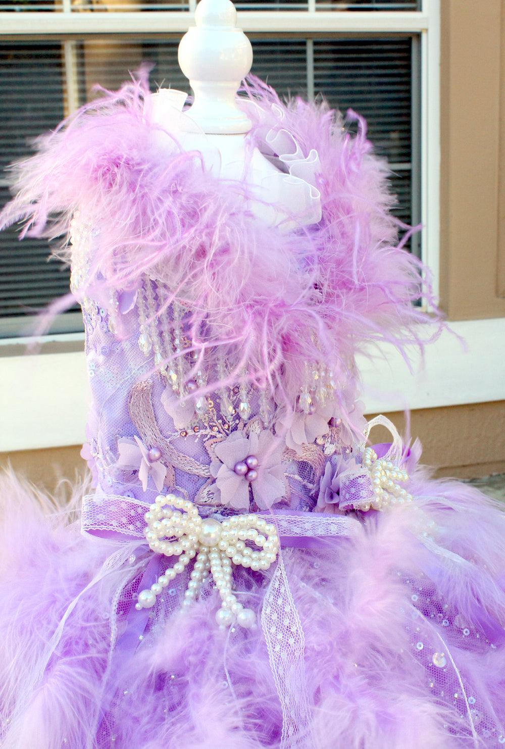 Side view of lavender floor length feather pet wedding gown