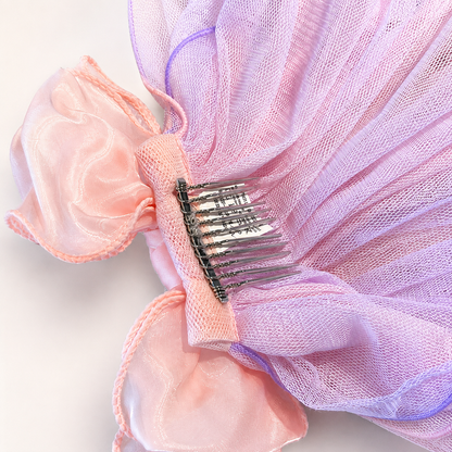 Back detail of pink tulle bow pet veil hair clip showing comb clip and mesh layers