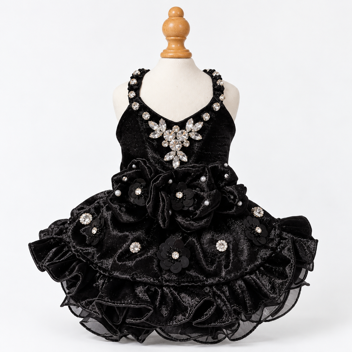 Front view of black satin pet dress with clear gem trim and layered ruffle skirt
