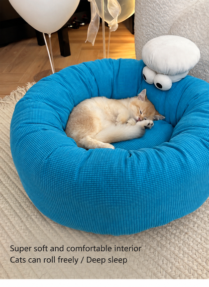 Monster Face Round Bolster Cat Bed - cat curled in blue bolster bed - image 7