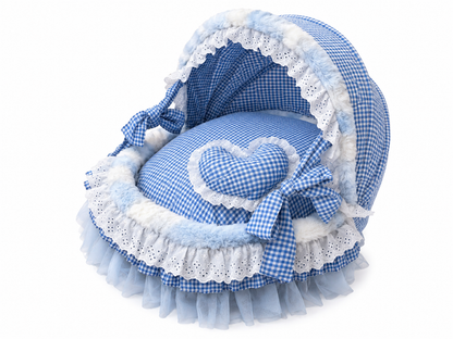 Front view of blue gingham canopy pet bed with lace trim, heart pillow, and bow accents