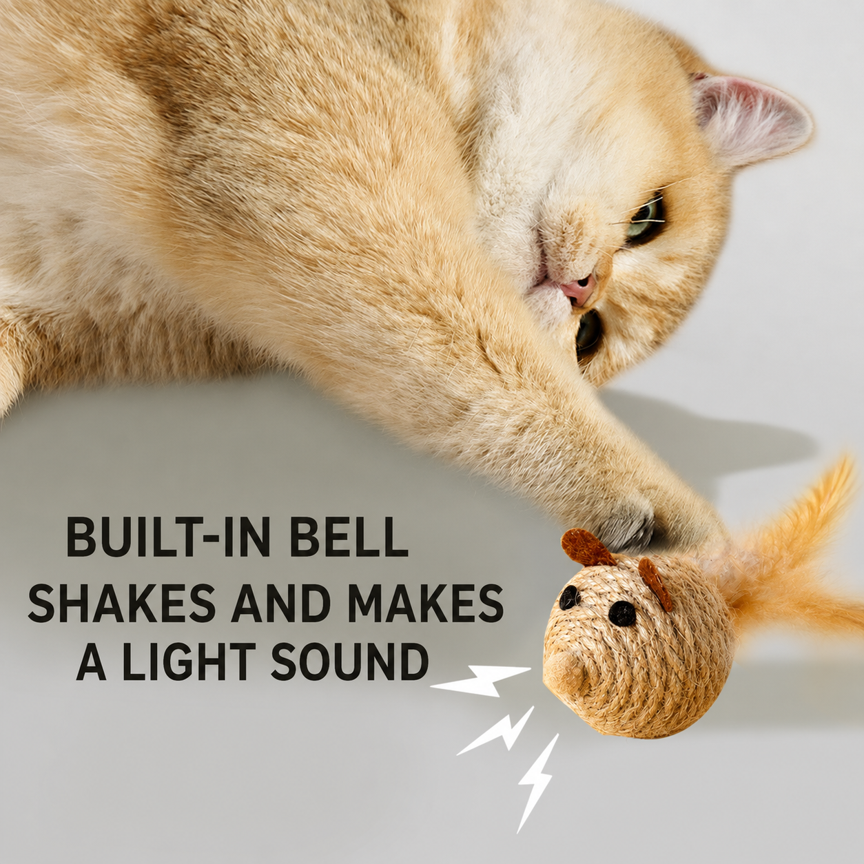 Cat batting a natural sisal mouse toy with built-in bell
