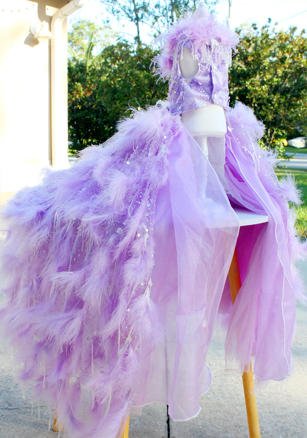 Close up feather and crystal fringe detail on handmade pet wedding gown