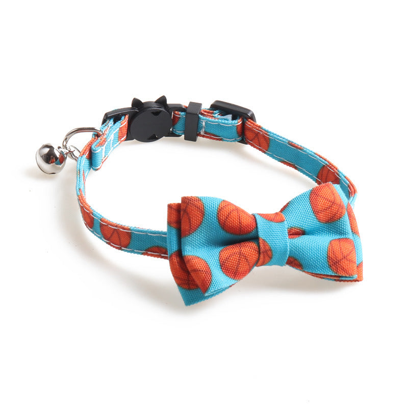 Blue basketball print bow tie cat collar with bell and adjustable buckle.