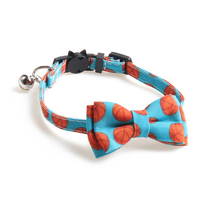 Blue basketball print bow tie cat collar with bell and adjustable buckle.