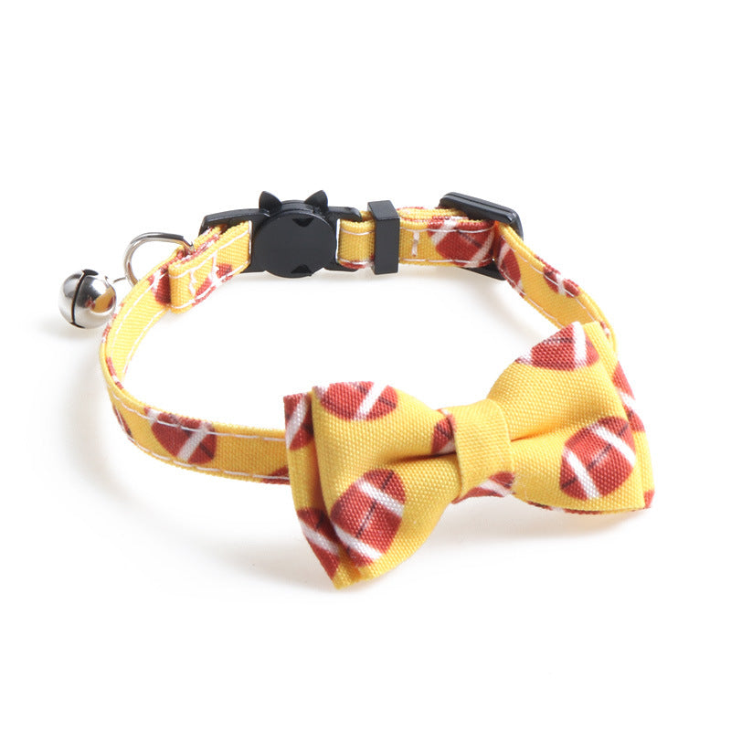 Yellow football print bow tie cat collar with bell and black cat-face buckle.