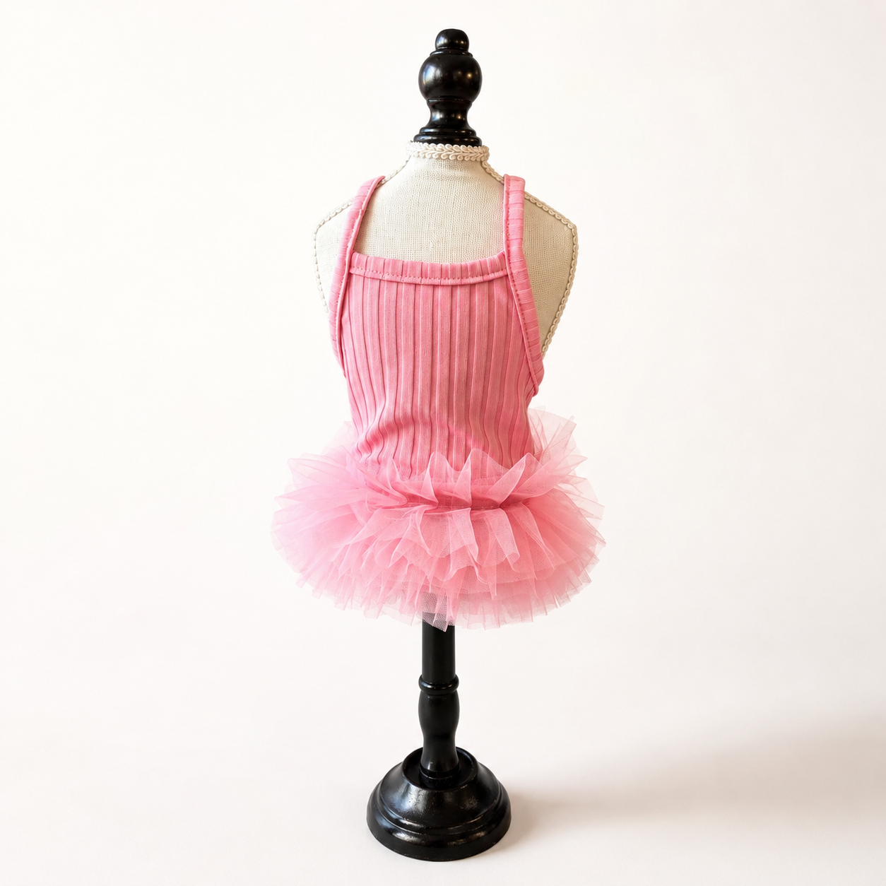 Pink cooling ice silk dog tutu dress displayed on boutique mannequin