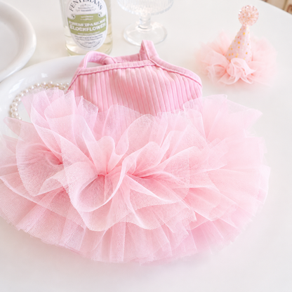 Close-up detail of pink ice silk ribbed dog dress with fluffy layered tulle skirt