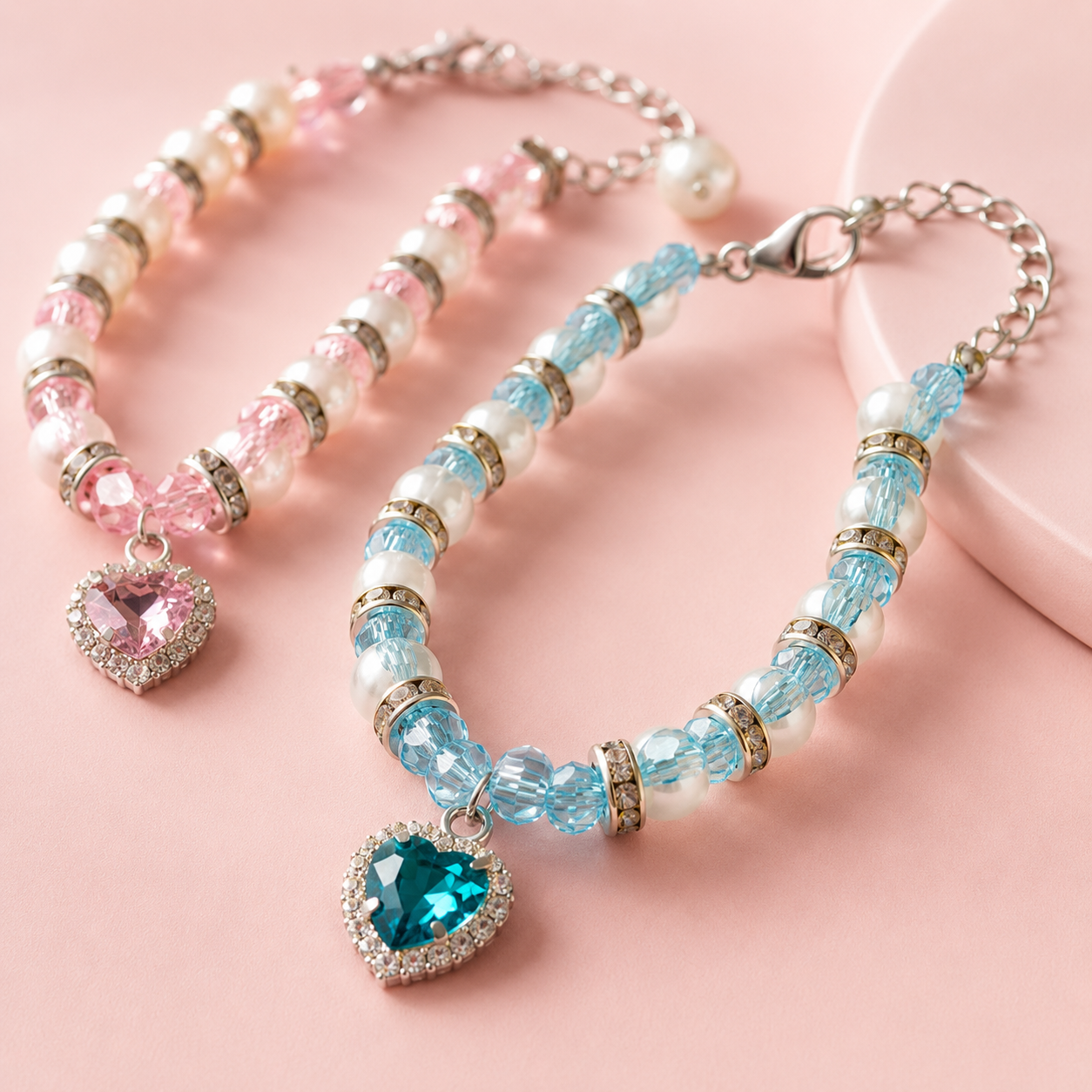 Boutique pet jewelry featuring sparkling heart pendants in pink and blue