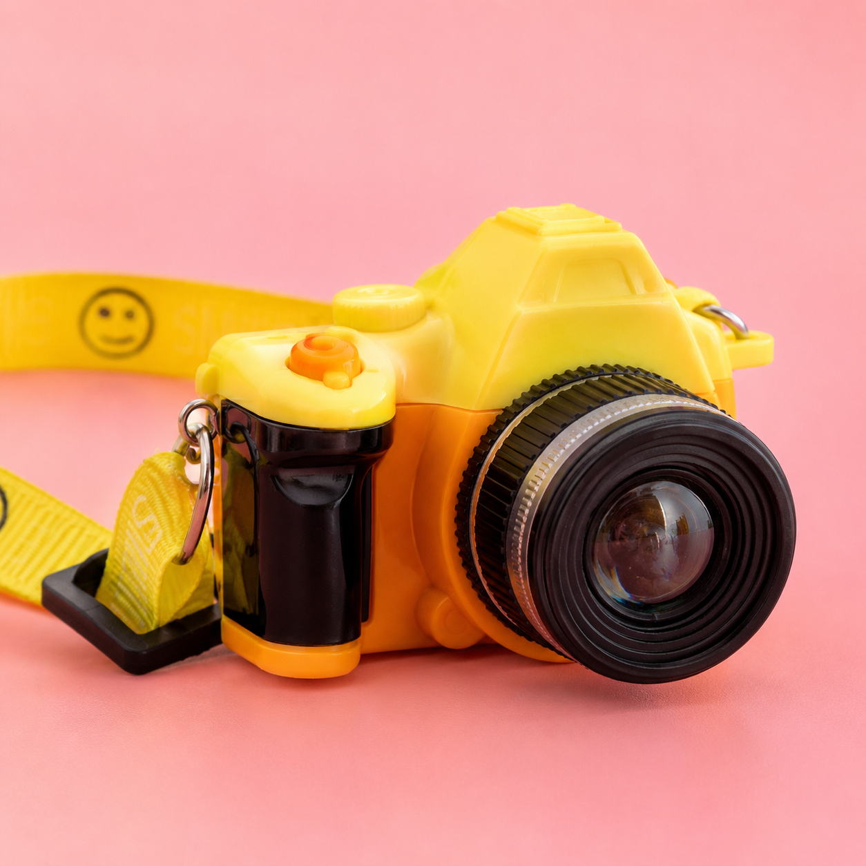 Back view of yellow interactive camera pet necklace with decorative screen, buttons and adjustable smile-print strap