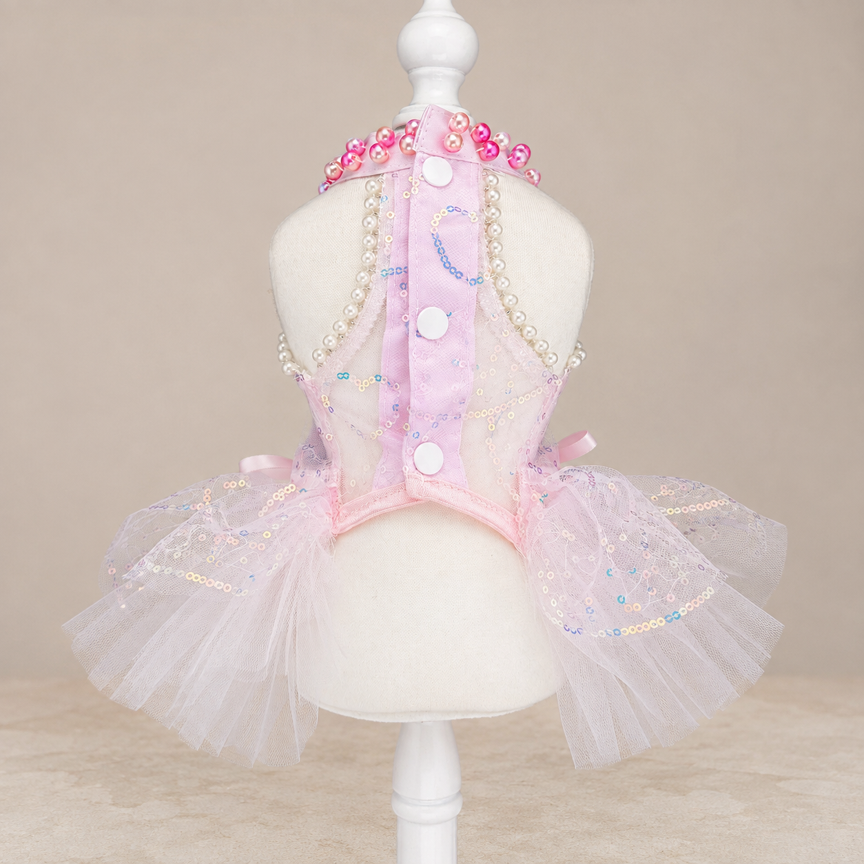 Back view of pink butterfly pet dress with white buttons and layered tulle