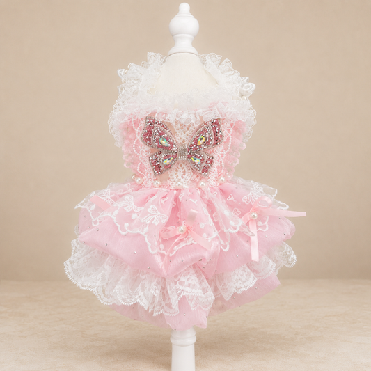 Pink lace tulle pet dress front view with butterfly bow and white ruffled neckline