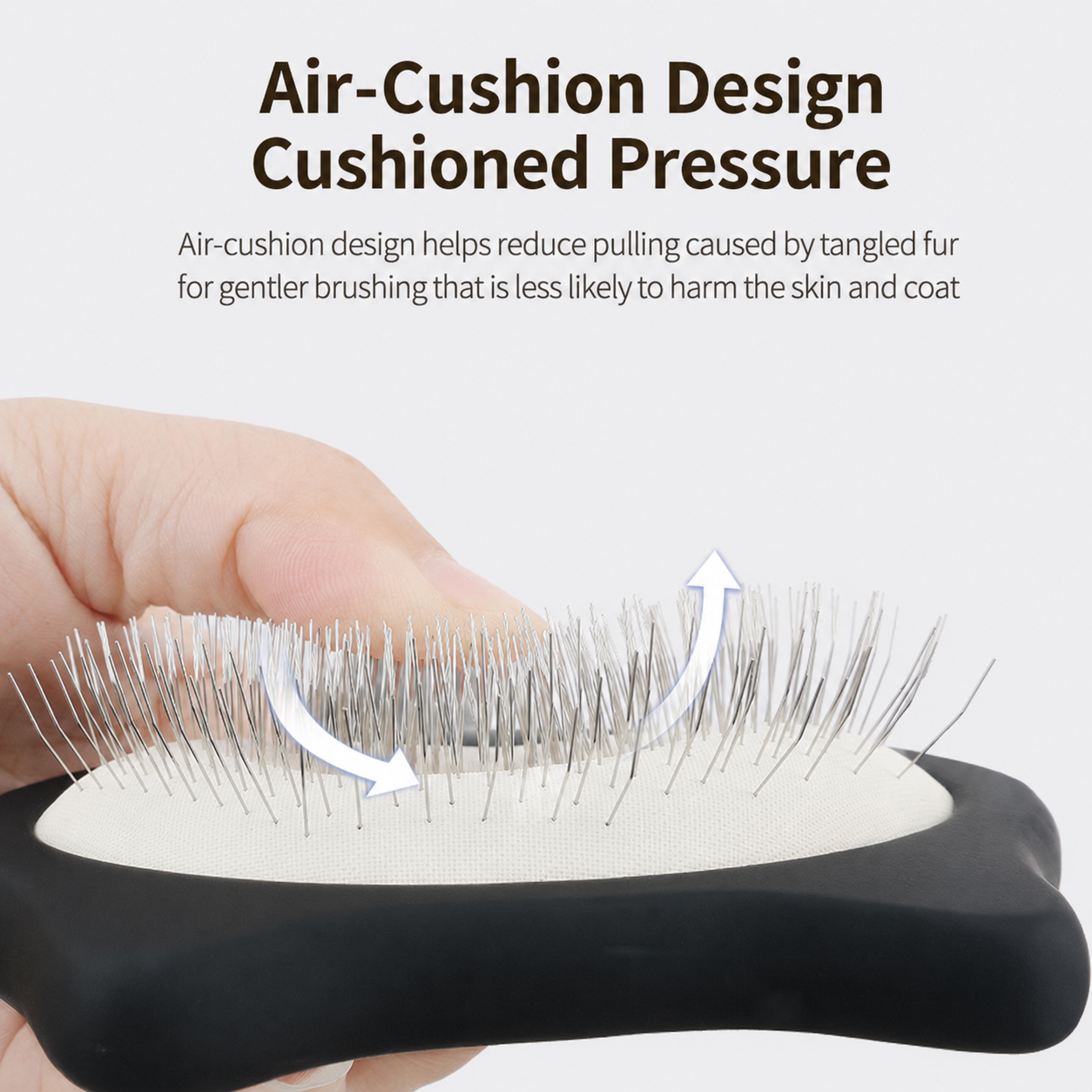 Close up of black pet slicker brush showing air-cushion pad and metal pins
